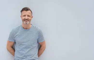 Our professional Thomas Miles in front of a gray background