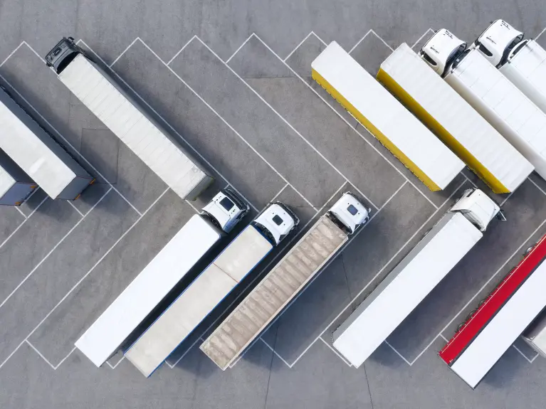 Trucks are parked in the parking lot.